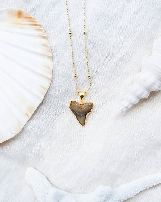 gold moana necklace