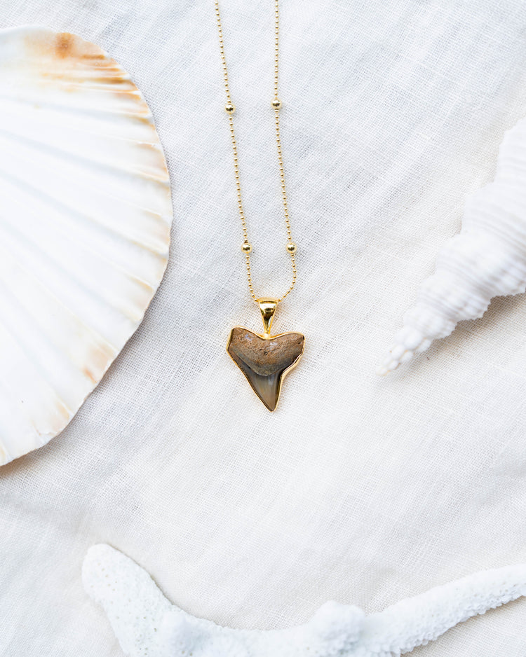 gold moana necklace
